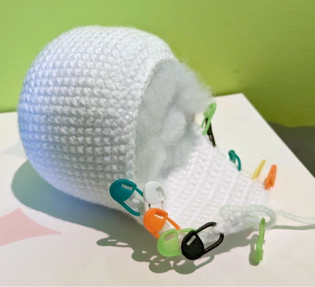Sommie's body after row 35. Stitch markers are placed in the first stitch of each short row.